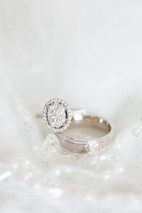 Oval Shaped Wedding Engagement Ring and Band Detail on Veil Portrait