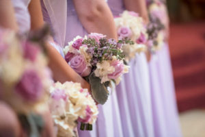 Wedding Ceremony , Bridesmaids in Purple Bridesmaids Dresses and Purple and White Rose and Lilac Floral Bouquets