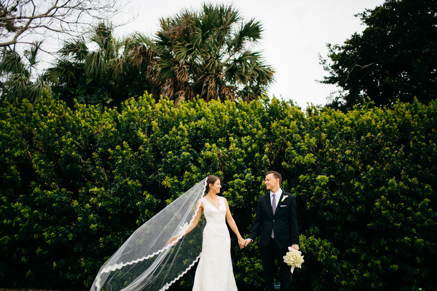 Outdoor, Sarasota Bride and Groom Wedding Portrait in Ivory, Lace Wedding Dress and Chapel Veil and Black Groom's Suit