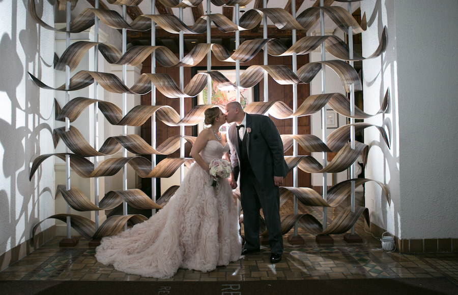 Bride and Groom Wedding Portrait in Charcoal Suit and Blush Madison James Wedding Dress with Ivory and Pink Floral Wedding Bouquet | St. Pete Wedding Photography Carrie Wildes Photography at Vinoy Renaissance Wedding Venue