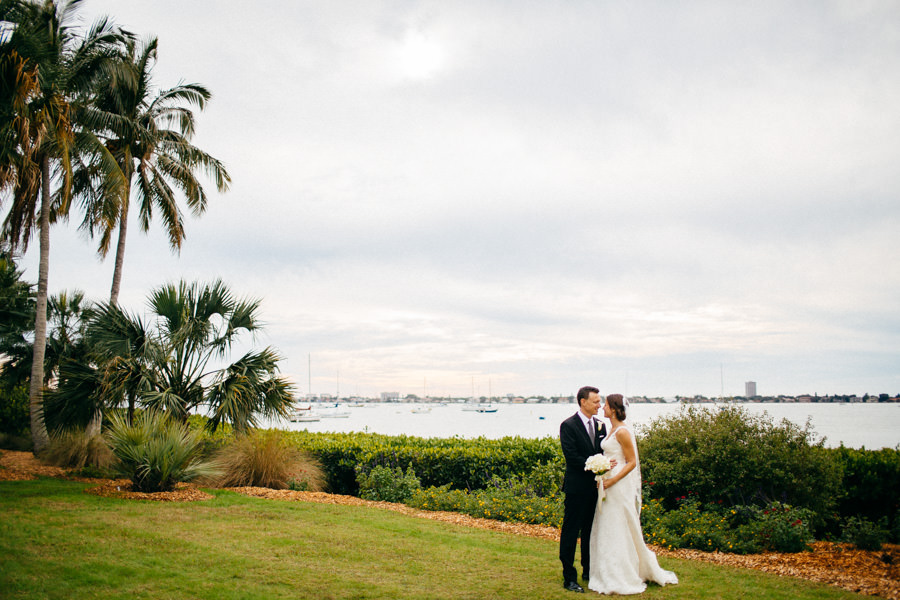 Outdoor, Waterfront Bride and Groom Wedding Portrait at Sarasota Wedding Venue Marie Selby Gardens