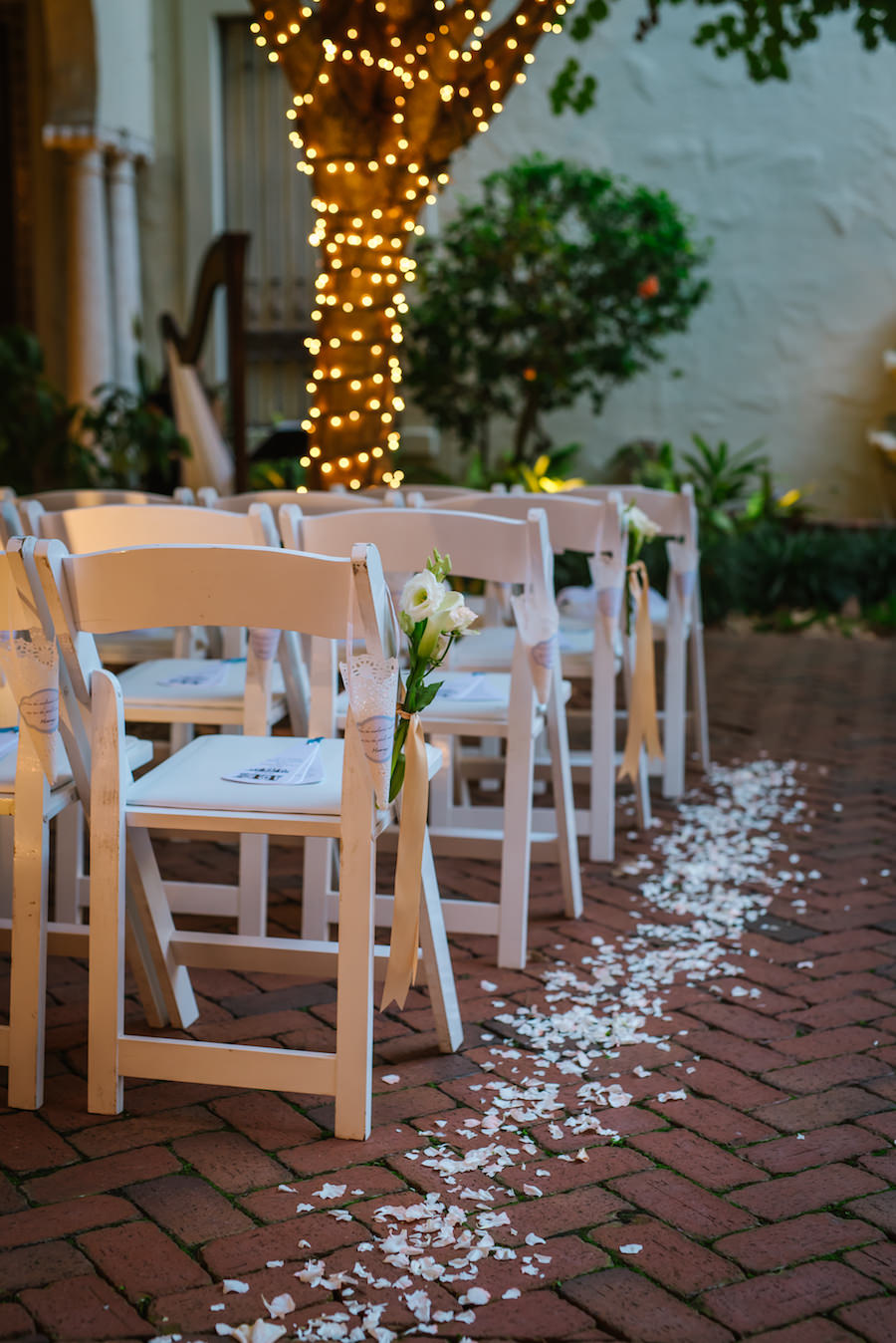 Elegant Wedding Ceremony with White Flower Petal Lined Aisle and Twinkle Lights | St Petersburg Wedding Planner Kimberly Hensley Events at St. Pete Wedding Venue The Museum of Fine Art