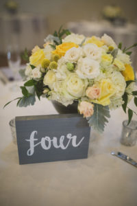 Rustic Ivory and Yellow Wedding Centerpieces in Gray Vase with Wooden Table Number | Andrea Layne Floral Design Sarasota FL Wedding Florist