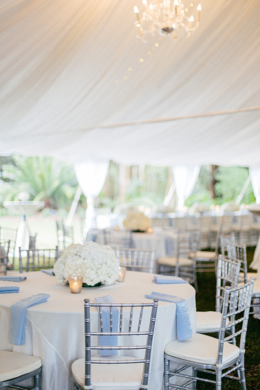 Wedding Reception Table Decor with Silver Chiavari Chairs, Blue Crushed Linens and White Floral Hydrangeaa Centerpieces