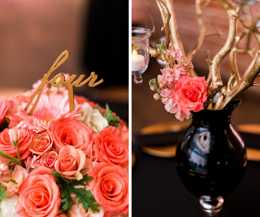 St. Pete Wedding Reception Table Decor with Coral and Pink Arrangement of Roses Daisies and Greenery Flowers in Black Vase Centerpieces with Gold Cursive Table Numbers