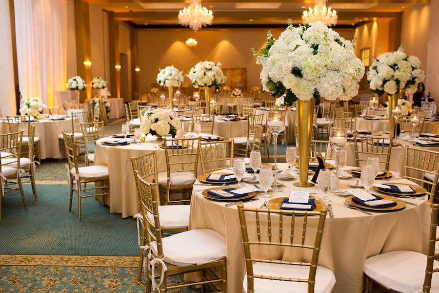 Gold Wedding Reception with Ivory and White Tall Centerpieces and Gold Chargers and Chiavari Chairs | Tampa Bay Wedding Ballroom Venue The Palmetto Club