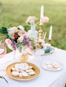DIY Wedding Reception Favor Table with Hand Painted Cookie Bar and Tulle Tableskirt with Vintage Pieces and Garden Floral Arrangements with Blush, Purple and Ivory Flowers| Tampa Wedding Rentals by Ever After Vintage Rentals