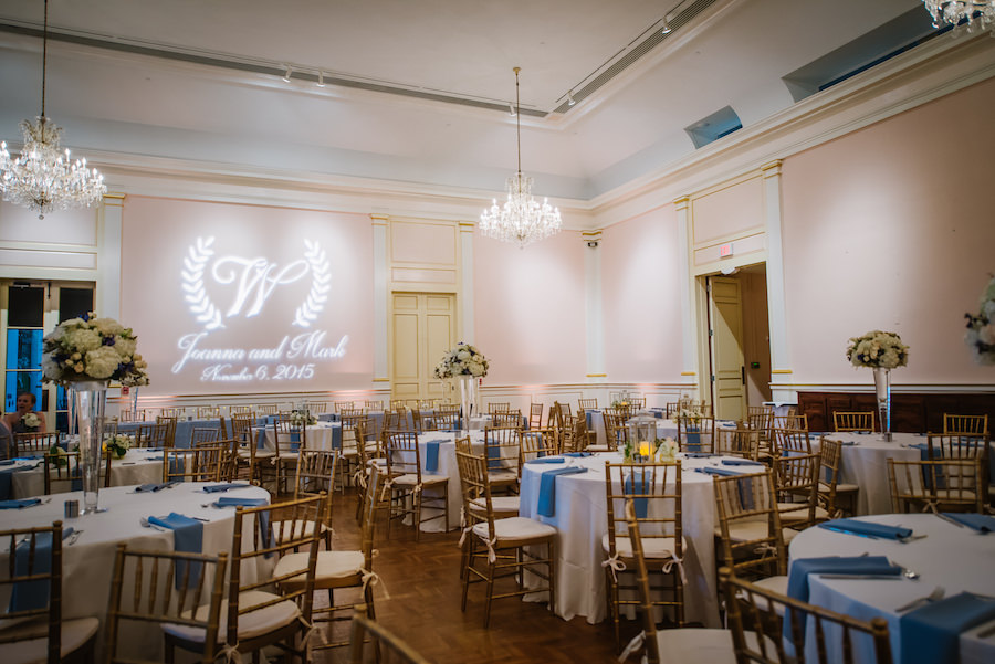 Ballroom Reception with Blue Linens, Tall White Centerpieces and Glass Vases, Monogrammed GOBO and Chandelier | Downtown St. Pete Wedding Venue Museum of Fine Arts | St. Petersburg Wedding Planner Kimberly Hensley Events