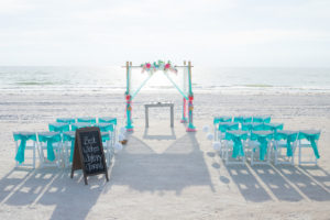 Beach, Waterfront Wedding Ceremony with Bamboo Altar and Pink and Teal Floral and Draping Accent Details | St. Pete Beach Wedding Planners Tide the Knot Beach Weddings
