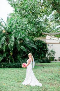 Outdoor, St. Pete Bridal Wedding Portrait in Ivory Wedding Dress and Veil and Coral and Pink Bridal Bouquet of Flowers