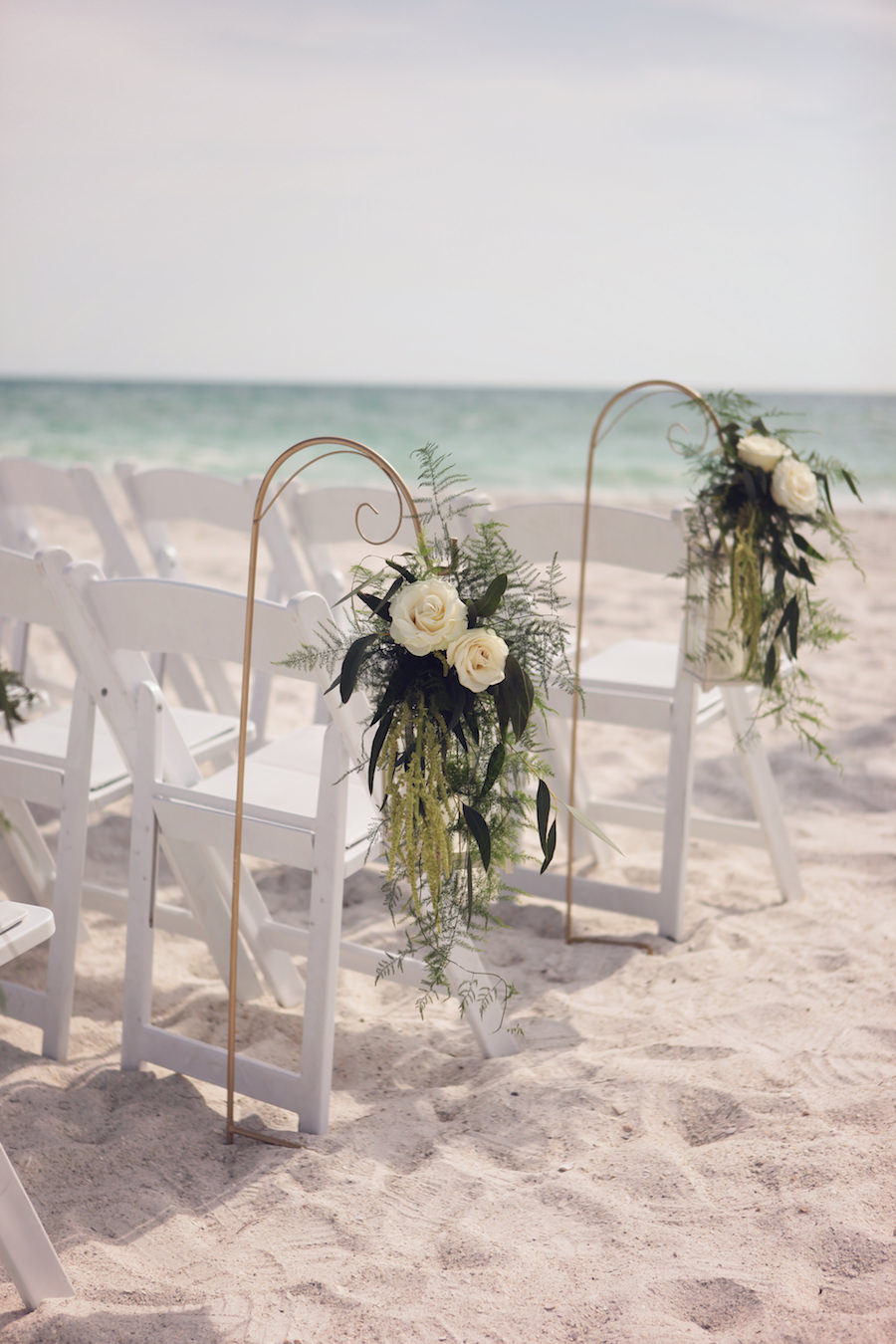 Bradenton Waterfront Beach Wedding Ceremony with Hanging Ivory Floral Aisle Decor
