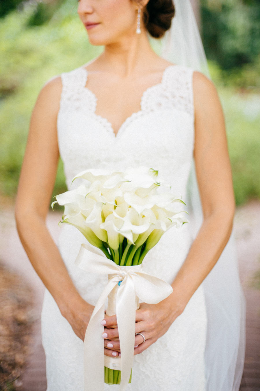 Outdoor, Bridal Wedding Portrait in Ivory, Lace Augusta Jones Wedding Dress, Chapel Length Veil and White Calla Lily Bridal Bouquet