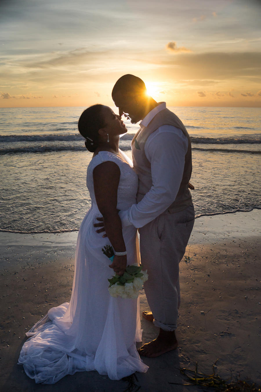 St. Pete Beach Waterfront Beach Sunset Bride and Groom Wedding Portrait