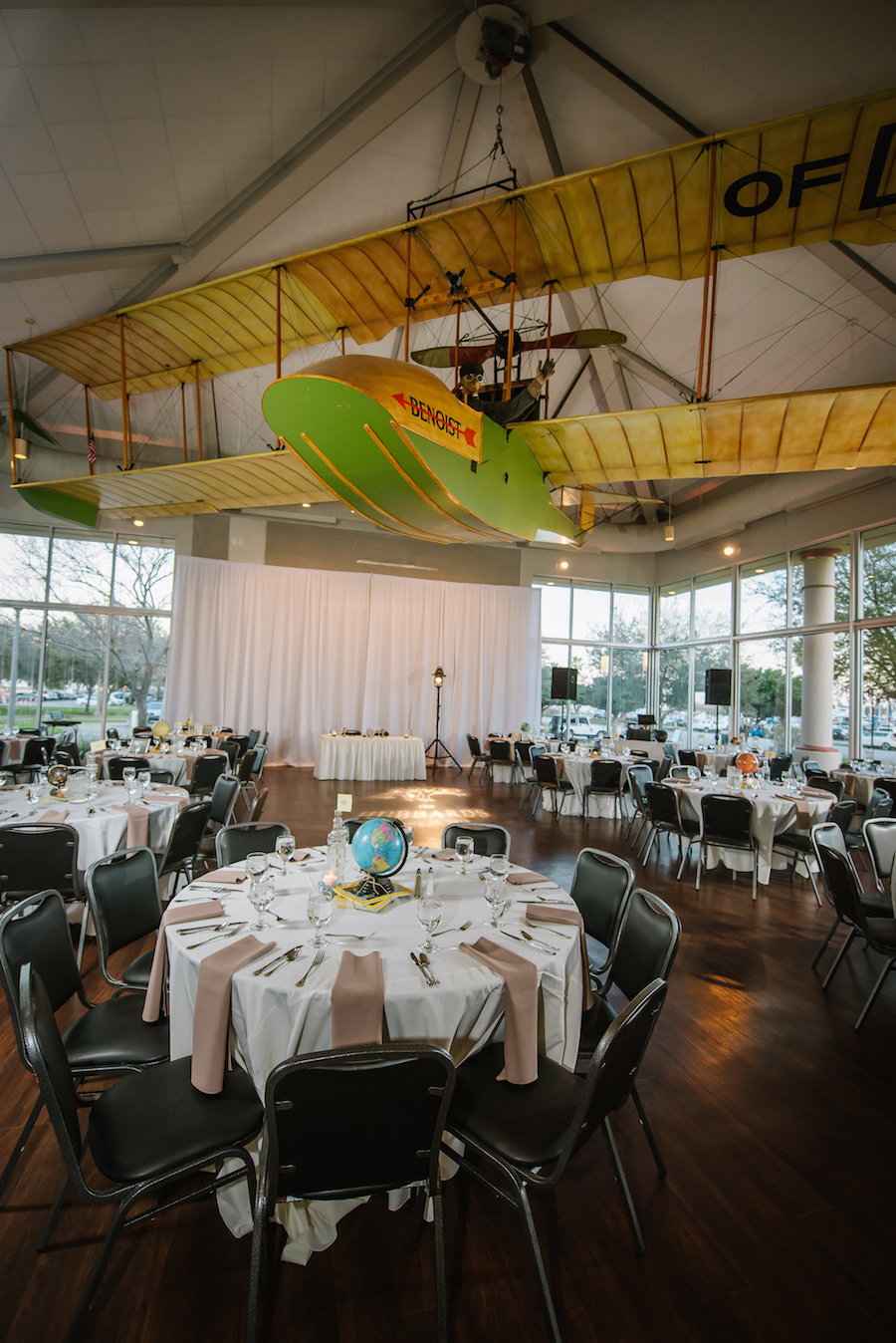 Eclectic Travel Inspired St. Petersburg Wedding in Airport Hanger Museum with Globes, National Geographic Magazines