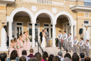 Bride and Groom First Kiss at Outdoor Wedding Ceremony | Lakeland Wedding Venue Sorosis Building | Wedding Photographer Rad Red Creative