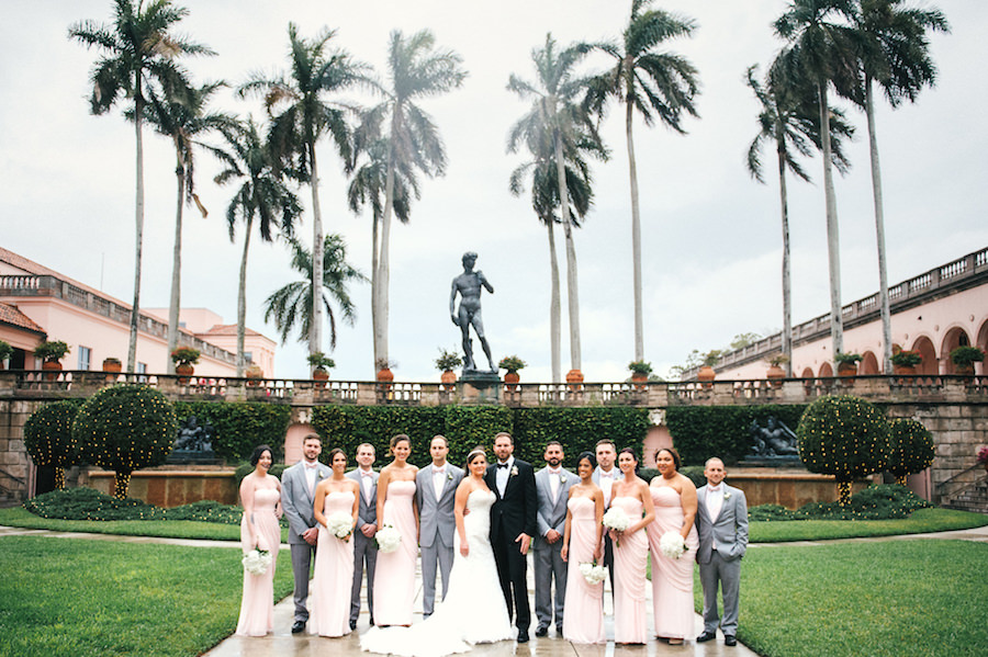 Outdoor Sarasota Bridal Party Wedding Portrait | Blush Pink Strapless Bridesmaid Dresses with Groomsmen in Grey Tuxedos and White Sweetheart Wedding Dress with White Floral Wedding Bouquets | Blush and Grey Wedding Party | Sarasota Wedding Planner NK Productions