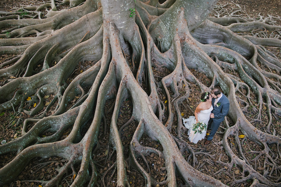 Bride and Groom Wedding Portrait Under Banyan Tree at Sarasota Wedding Venue Marie Shelby Botanical Gardens | Wedding Bouquet and Flower Headpiece by Andrea Layne Floral Designs