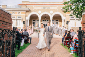 Bride and Groom Walking Down Aisle at Outdoor, Wedding Ceremony | Lakeland Wedding Venue Sorosis Building | Wedding Photographer Rad Red Creative