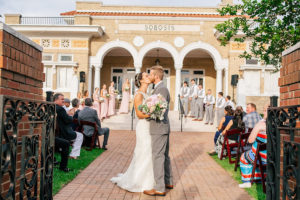 Bride and Groom Kiss at at Outdoor, Wedding Ceremony | Lakeland Wedding Venue Sorosis Building | Wedding Photographer Rad Red Creative