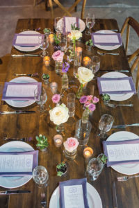 Rustic Garden Wedding Reception Table Decor with Farmhouse Table, Wooden Chairs, and Ivory and Purple Floral Centerpieces | Tampa Wedding Florist Andrea Layne Floral Designs