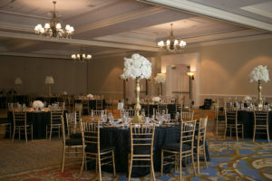 Elegant Ballroom Wedding Reception with Tall White Flower Centerpieces, Gold Chiavari Chairs and Black Linens at Downtown Tampa Waterfront Wedding Venue Marriott Waterside | Flowers by Northside Florist | Tampa Wedding Photographer Carrie Wildes Photography