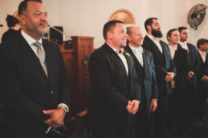 Groom's Reaction to Seeing Bride Walk Down Aisle During Wedding Ceremony