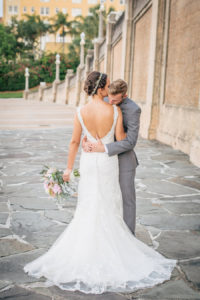 Outdoor, Bride and Groom Wedding Portrait in Low Back Ivory, Lace Wedding Dress and Grey Groom's Suit | Lakeland Wedding Photographer Rad Red Creative