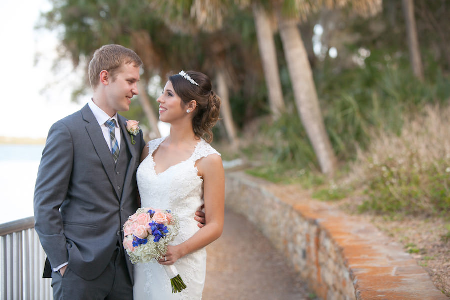 Outdoor, Bride and Groom Wedding Portrait in Lace Pronovias Wedding Dress and Grey Groom's Suit | Safety Harbor Wedding Photographer Carrie Wildes Photography