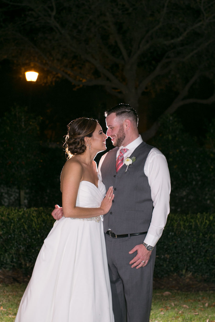 Outdoor, Nighttime, Bride and Groom Wedding Portrait in Grey Groom's Suit and Strapless, Ivory Wedding Dress | Tampa Wedding Photographer Carries Wiles Photography