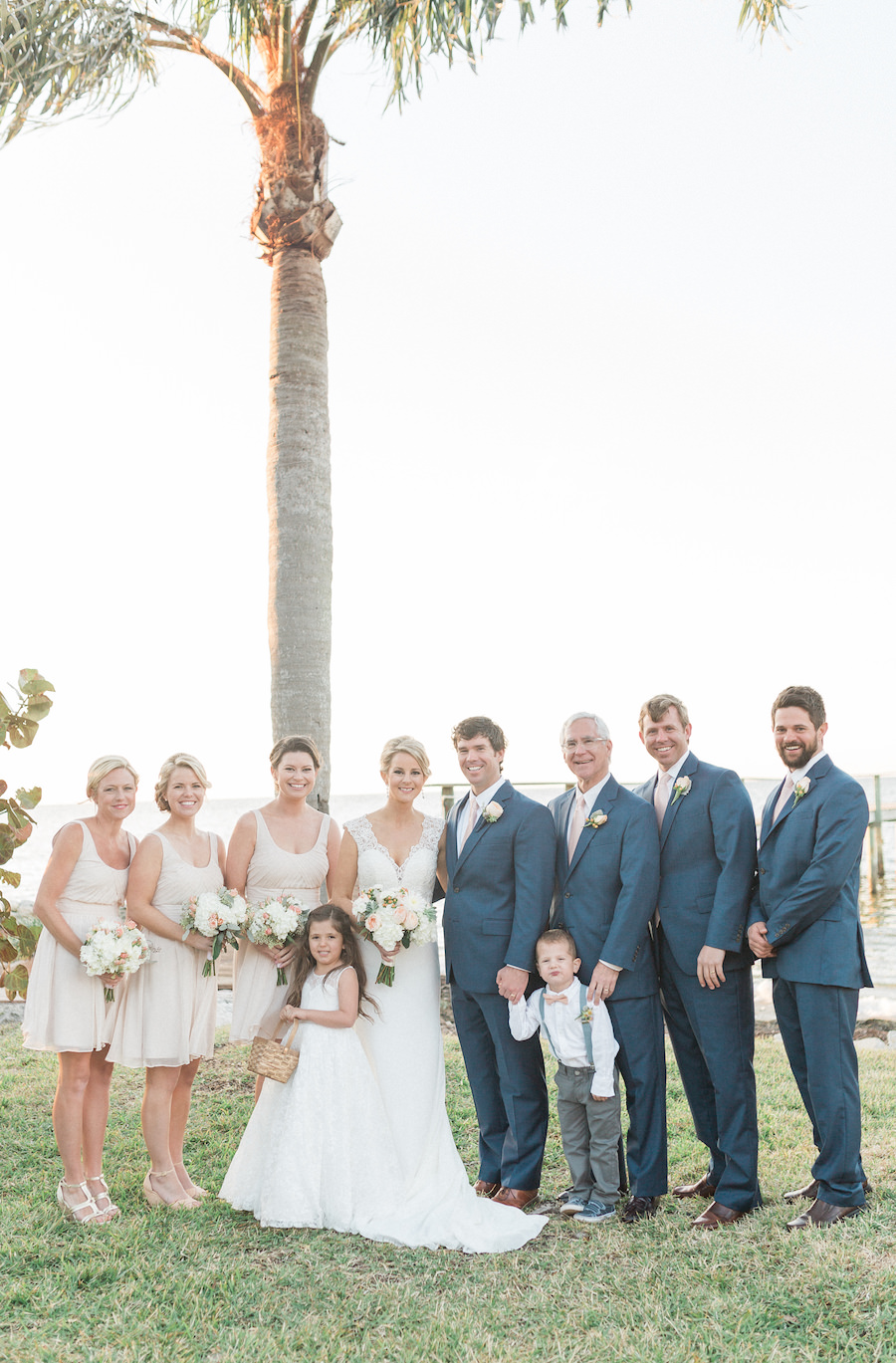 Outdoor, Bridal Party Wedding Portrait with Bridesmaids and Groomsmen | Bridesmaids in Neutral Tea Length Wedding Dresses and Groomsmen in Navy Blue Suits
