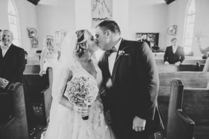 Bride and Groom Processional Kiss Wedding Ceremony Portrait at Amazing Love Ministries Ybor City