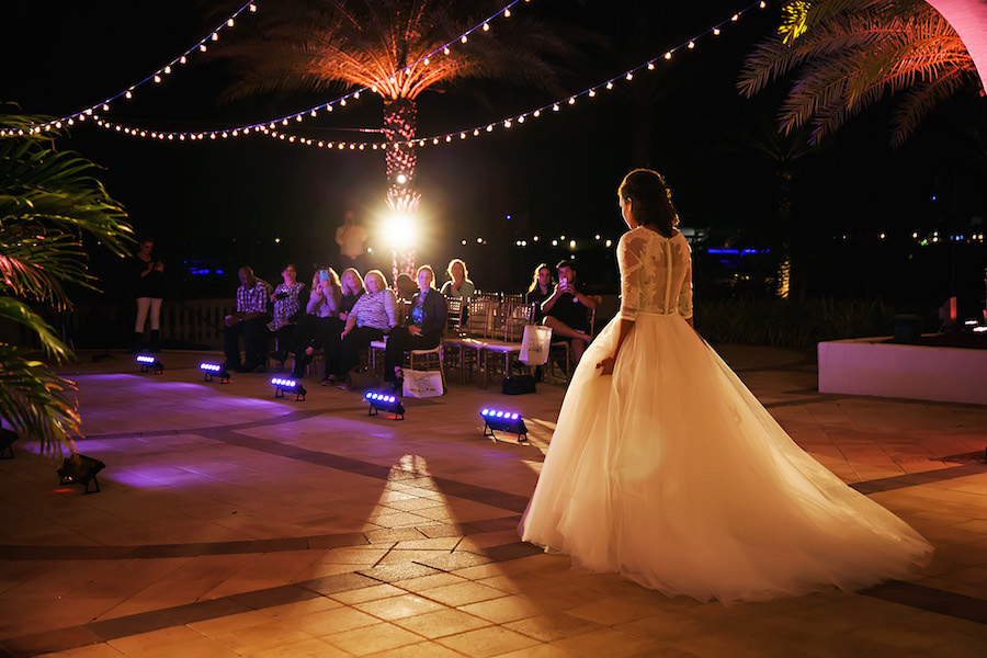 Marry Me Tampa Bay Wedding Week Fashion Show | Model in Wedding Dress with Tulle Skirt and Lace Sleeves | Tampa Bridal Salon Isabel O'Neil Bridal | Wedding Photographer Limelight Photography| Waterfront South Tampa Nautical Wedding Venue Westshore Yacht Club | Uplighting and GOBO by Nature Coast Entertainment Services