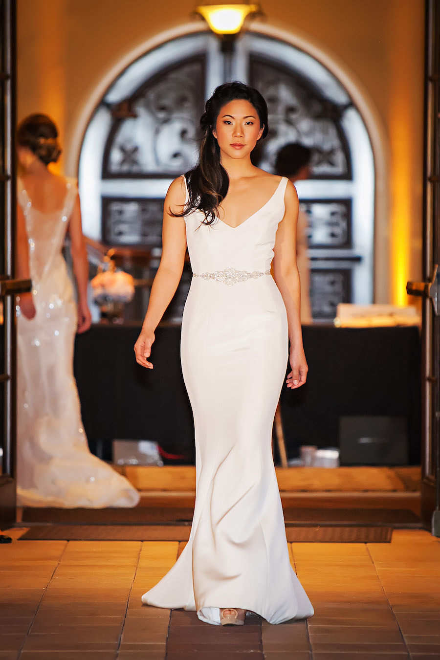 Marry Me Tampa Bay Wedding Week Fashion Show | Model in V-Neck Wedding Dress with Straps | Tampa Bridal Salon Isabel O'Neil Bridal | Wedding Photographer Limelight Photography