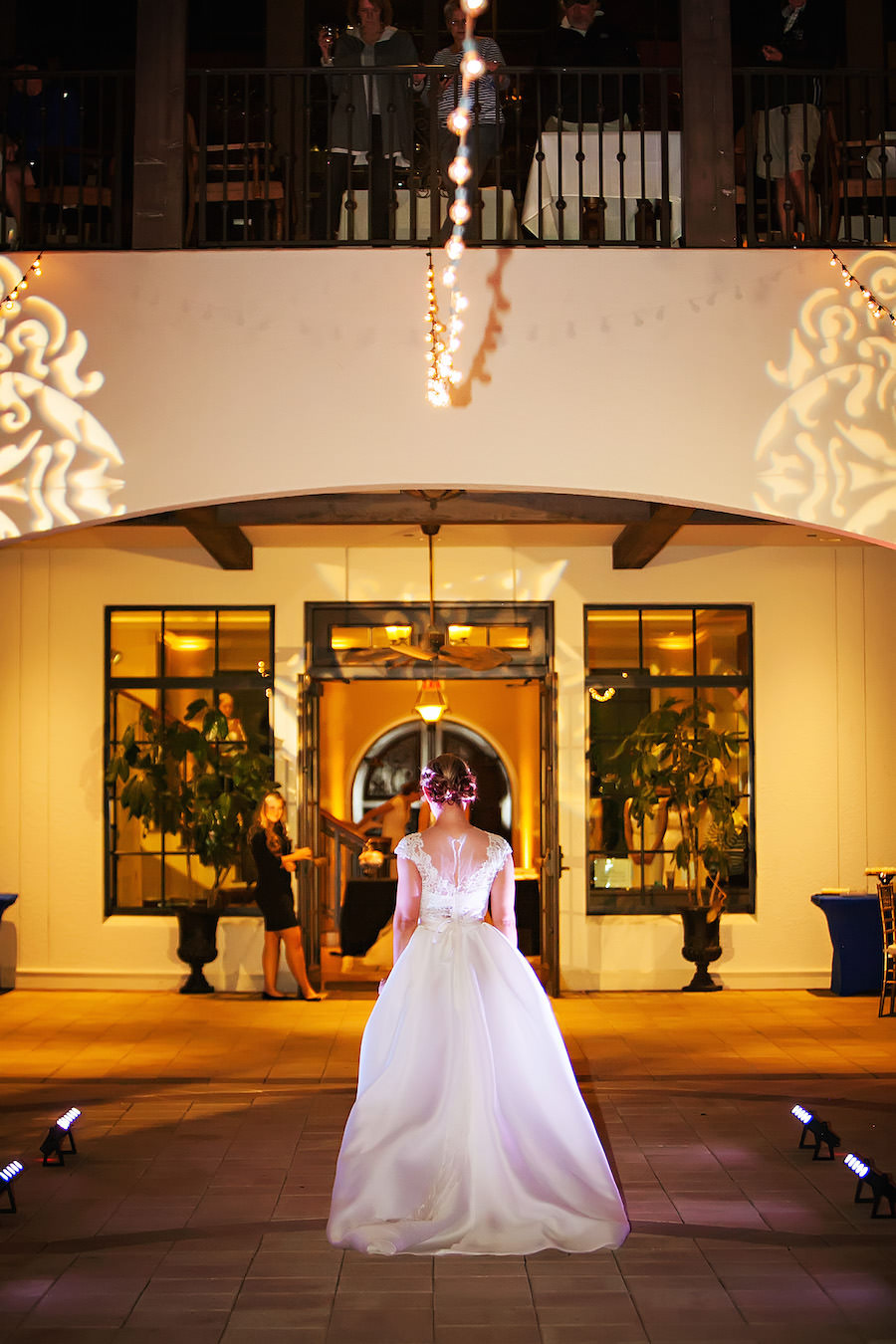 Marry Me Tampa Bay Wedding Week Fashion Show | Model in Ballgown Wedding Dress with and Lace Sleeves | Tampa Bridal Salon Isabel O'Neil Bridal | Wedding Photographer Limelight Photography| Waterfront South Tampa Nautical Wedding Venue Westshore Yacht Club | Uplighting and GOBO by Nature Coast Entertainment Services