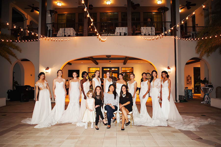 Marry Me Tampa Bay Wedding Week Fashion Show | Model in Lace Wedding Dress with Sleeves with Flower Girl | Tampa Bridal Salon Isabel O'Neil Bridal | Wedding Photographer Limelight Photography