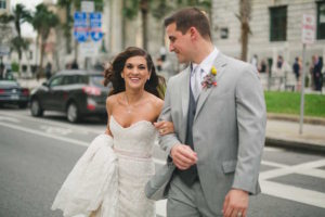 Downtown Tampa Bride and Groom Wedding Portrait in Light Grey Suit with Ivory Beaded Lace Ines DiSanto Wedding Dress from Isabel O'Neil Bridal Collection | Hair and Makeup by Lasting Luxe | Photography by Roohi Photography
