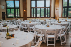 Wedding Reception Decor with White Linens, Flowers in Mason Jars, Vintage Books, and Succulents | Lakeland Rentals A Chair Affair | Lakeland Wedding Venue Sorosis Building