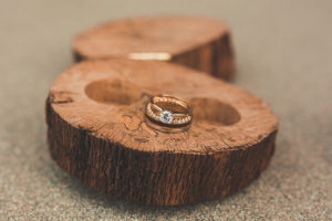 Bridal Wedding Band and Princess Cut Engagement Ring Portrait on Wood Round Slab