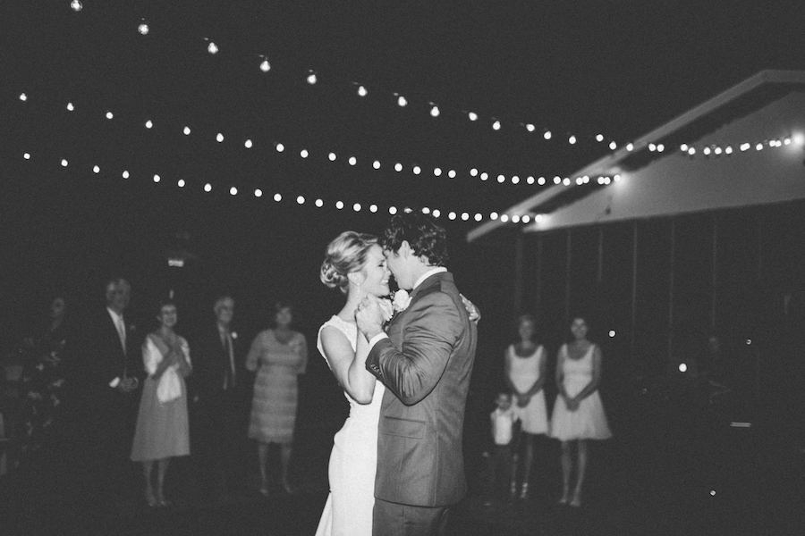 Outdoor Wedding Reception Bride and Groom First Dance with String Market Lights