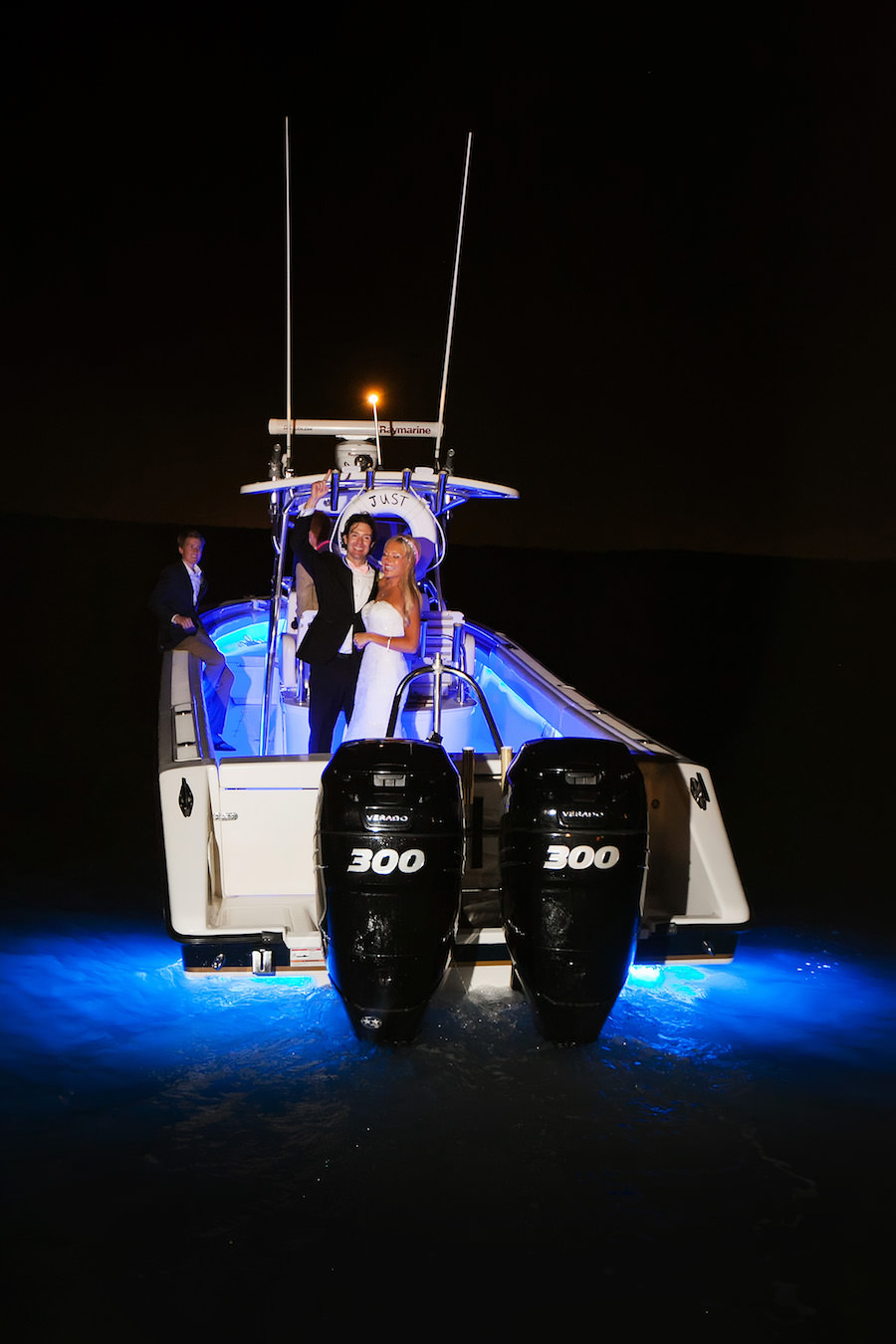 Bride and Groom Wedding Reception Exit By Boat | Clearwater Beach Wedding Photographer Limelight Photography
