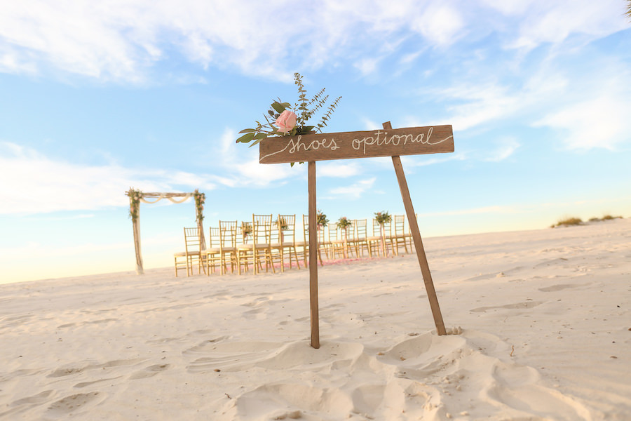 Beachfront Wedding Ceremony “Shoes Optional” Rustic Wooden Sign at Clearwater Beach Wedding Venue Hilton Clearwater Beach | Flowers by Iza’s Flowers, Gold Chiavari Chairs by Signature Event Rentals