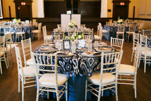 White Chiavari Chairs and Navy Blue Linens | Rentals by A Chair Affair and Over the Top Rental Linens Lakeland Wedding Venue Junior League Sorosis Building