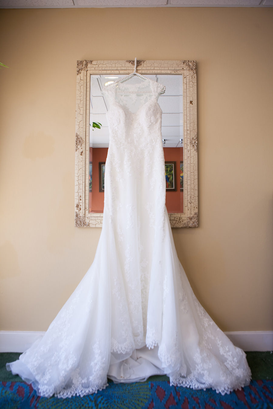 Ivory, Lace Pronovias Wedding Dress with See Through Back on Pearl Hanger | Safety Harbor Wedding Photographer Carrie Wildes Photography
