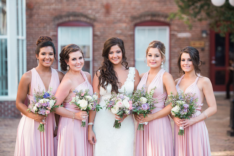 Bride and Bridesmaids Wedding Portrait in Blush Bridesmaids Dresses and Lace, White Wedding Dress and Purple and Ivory Floral Wedding Bouquets | Tampa Wedding Florist Andrea Layne Floral Design