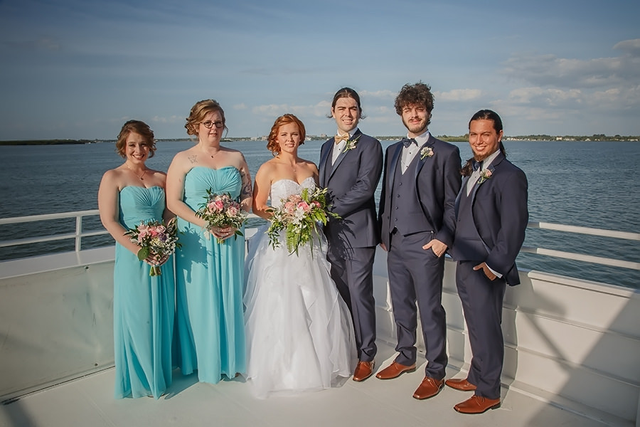 Bride In Alfred Angelo Wedding Dress And Teal Seafoam Green David S Bridal Bridesmaid Dresses And Navy Blue Groomsmen Suits Pink And Blue Wedding Bouquet Apple Blossoms Floral Designs Clearwater Waterfront