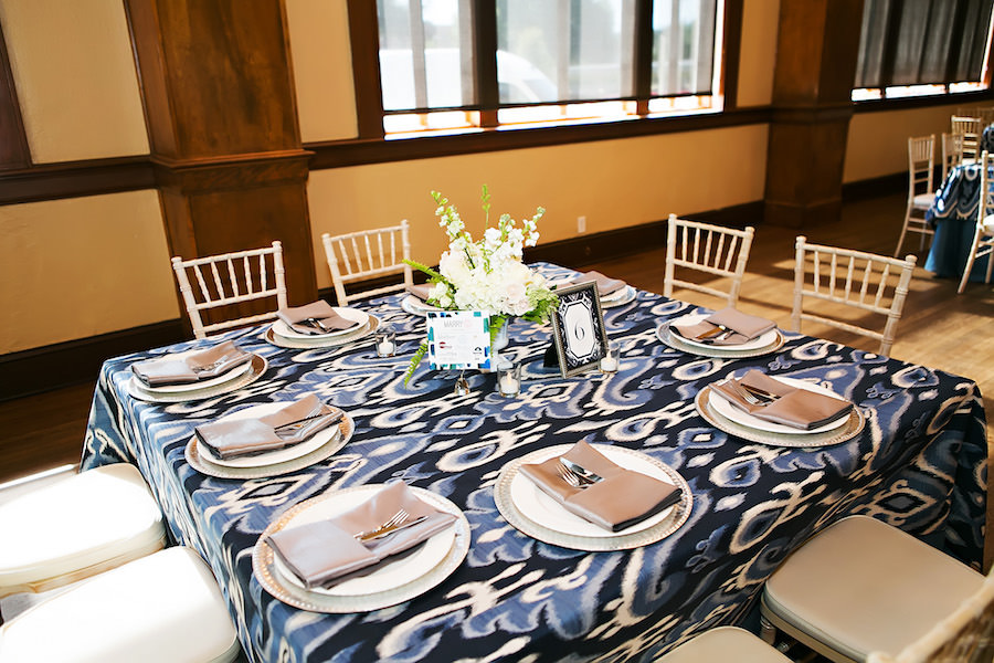 White Chiavari Chairs and Navy Blue Linens | Rentals by A Chair Affair and Over the Top Rental Linens Lakeland Wedding Venue Junior League Sorosis Building