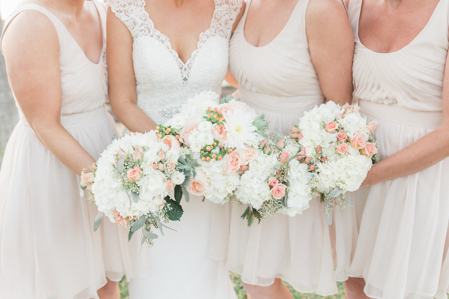 Bride and Bridesmaids Wedding Portrait in Neutral Bridesmaids Dresses, Ivory, Lace Allure Wedding Dress, and White and Pink Floral Wedding Bouquets
