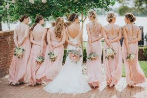 Outdoor, Bride and Bridesmaids Wedding Portrait in Pink Jim Hjelm Bridesmaids Dresses and Lacy, Ivory Wedding Dress | Tampa Bridesmaids Dress Shop Bella Bridesmaid