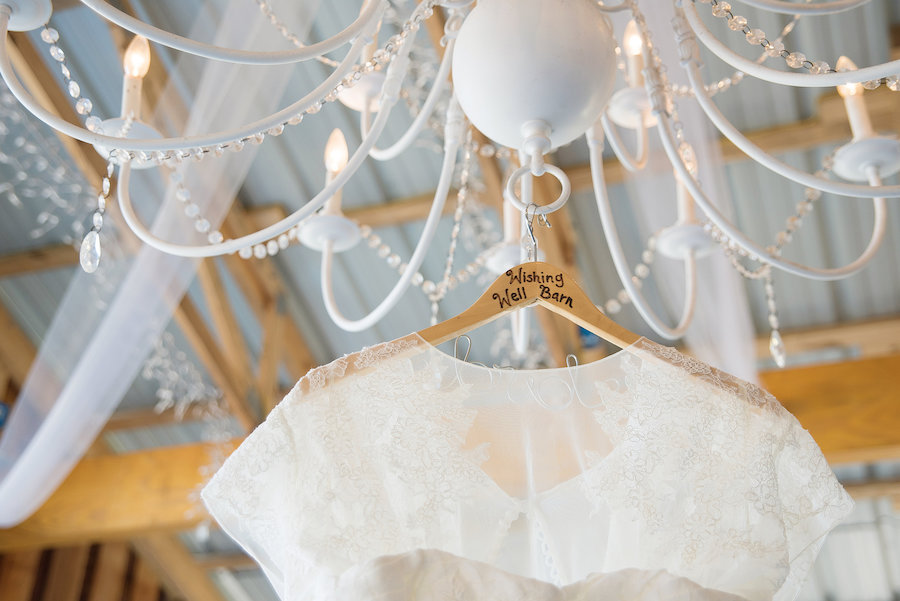 Ivory, Lace Wedding Dress Hung on Chandelier