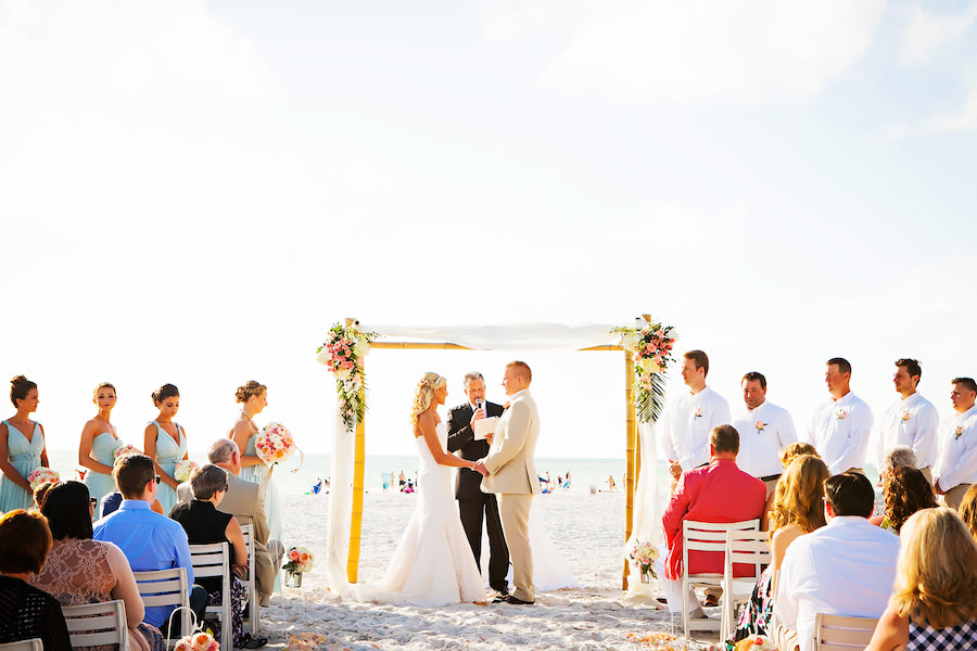 Bride and Groom Exchanging Vows at Hilton Clearwater Beach Wedding Ceremony | Clearwater Wedding Photographer Limelight Photography | Wedding Florist Iza's Flowers